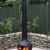 Kaska Cast Iron and Steel Chiminea with fire in garden